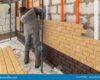 Installing Brick Siding on the Wall of the House Editorial Stock Image ...
